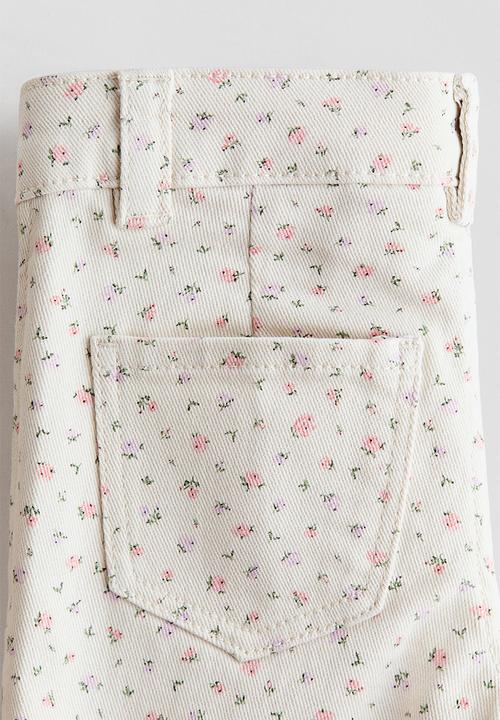 H&M - Flared jeans - cream/floral