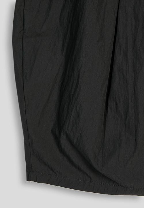 Pop Candy - Pleated barrel wide-leg trousers with waist ruffle - black