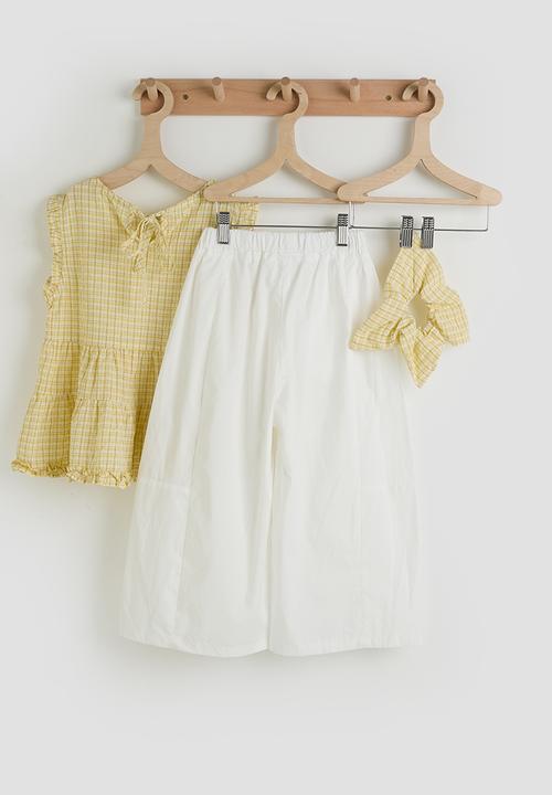 Pop Candy - Ruffle hem peplum top & panelled pants - light yellow/white