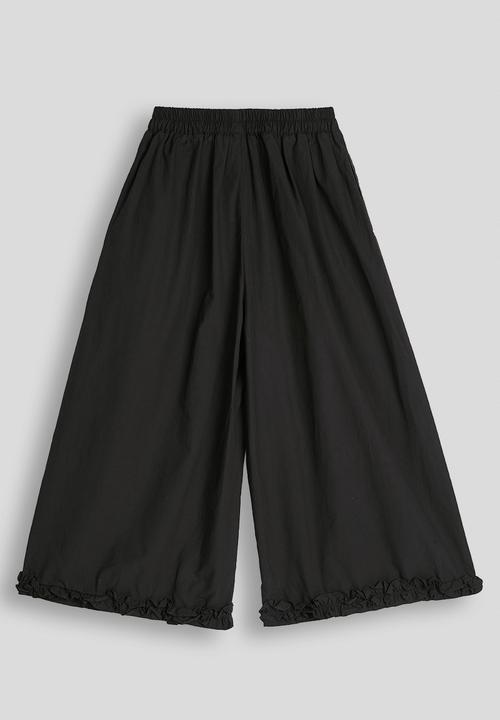 Pop Candy - Ruffle hem wide leg pants - black