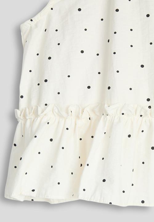 Pop Candy - Dotted pattern dropped hem top - cream