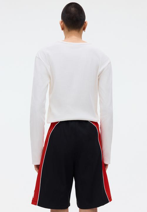 H&M - Loose fit printed shorts - black/honda