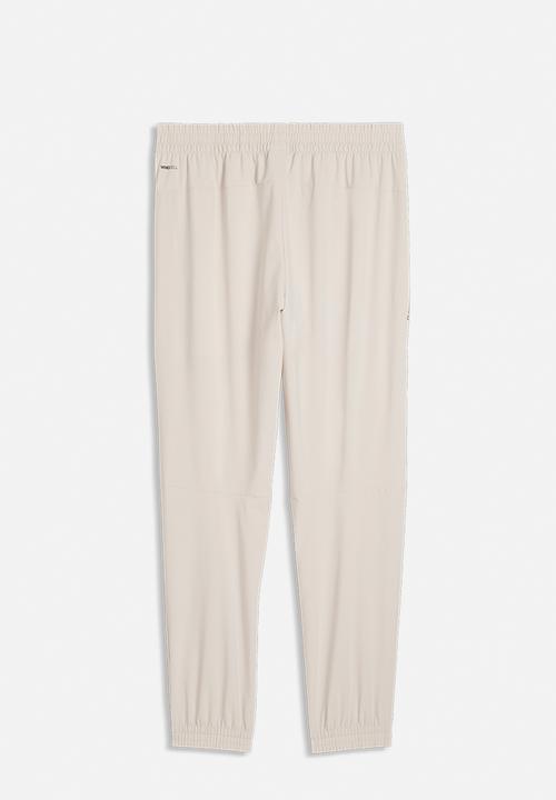 PUMA - PUMATECH 4-Way Stretch Woven Pants - Beige