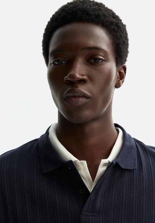 H&M - Slim fit textured jersey polo shirt - navy blue