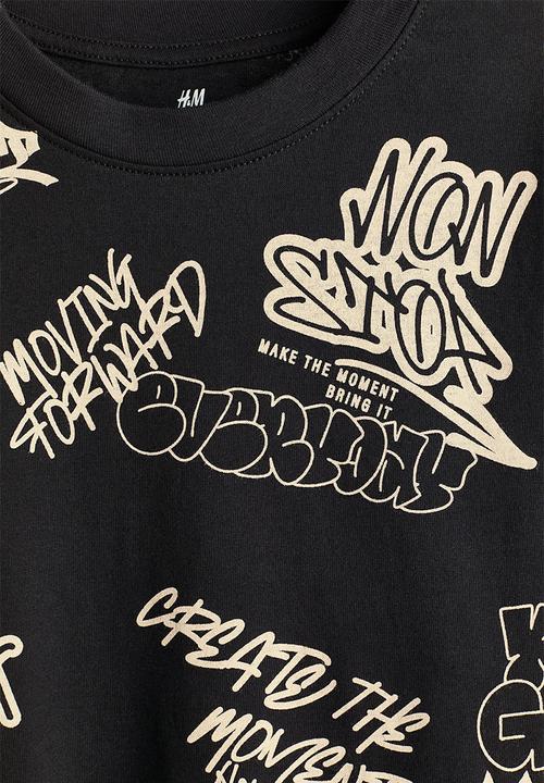 H&M - Printed cotton t-shirt - black/graffiti