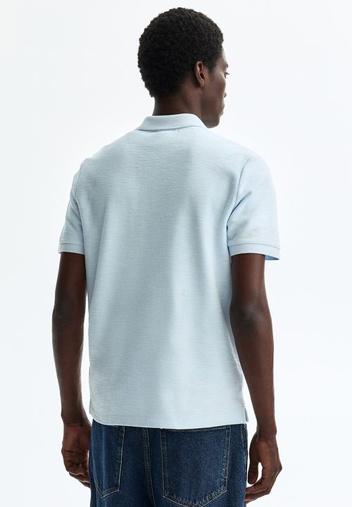 H&M - Slim fit jacquard-knit polo shirt - light blue
