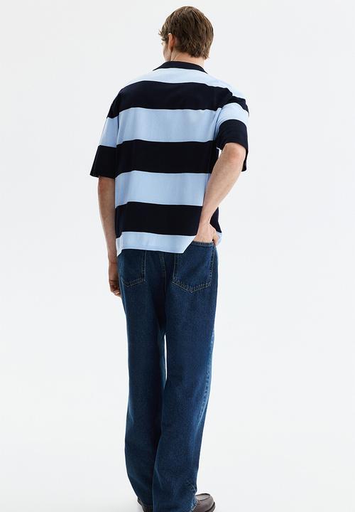 H&M - Loose fit polo shirt - navy blue/striped