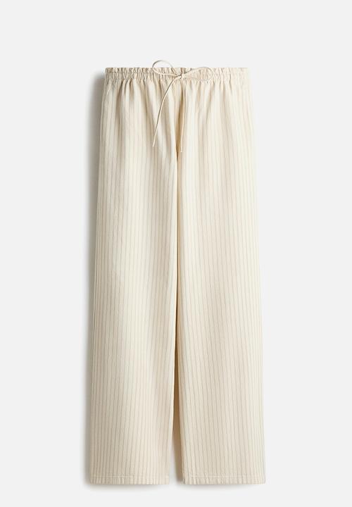 H&M - Denim pull-on trousers - light beige/striped