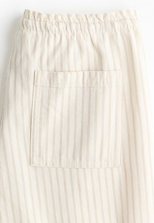H&M - Denim pull-on trousers - light beige/striped