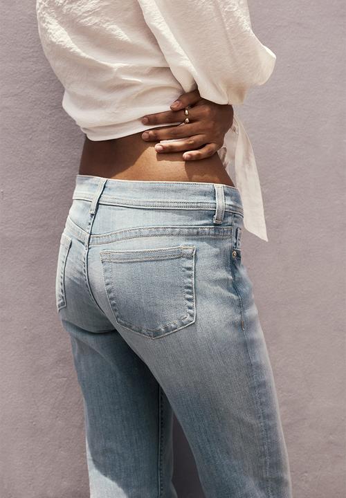 H&M - Flared leg ultra low waist jeans - light denim blue