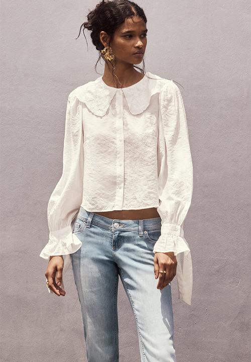 H&M - Flared leg ultra low waist jeans - light denim blue