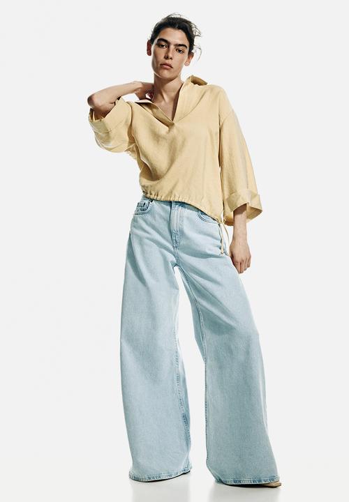 H&M - Super wide high waist jeans - light denim blue