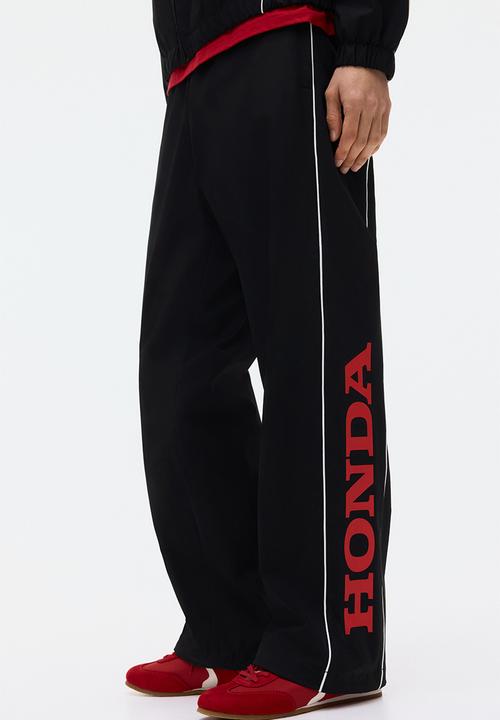 H&M - Relaxed fit printed track pants - black/honda