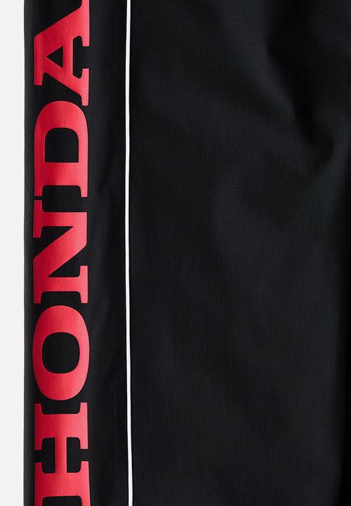 H&M - Relaxed fit printed track pants - black/honda