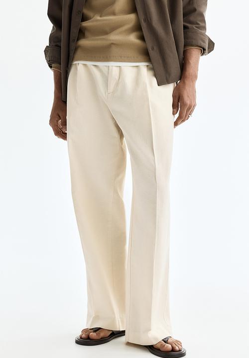 H&M - Loose fit wide linen-blend trousers - cream