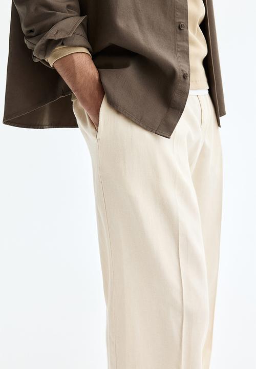 H&M - Loose fit wide linen-blend trousers - cream