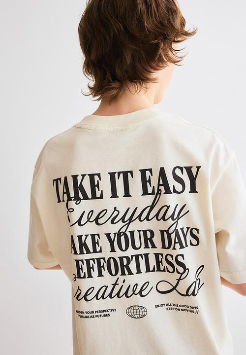 H&M - Loose-fit printed t-shirt - cream/effortless