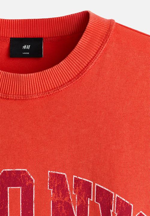 H&M - Loose fit printed t-shirt - bright orange/soho nyc