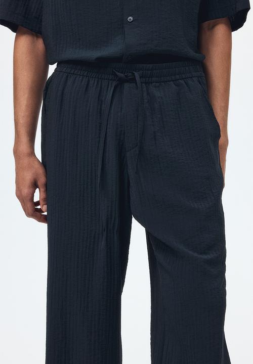 H&M - Relaxed fit textured trousers - black