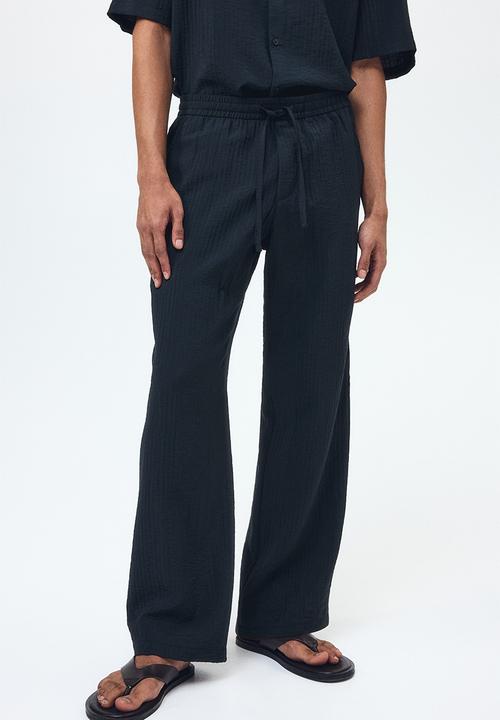 H&M - Relaxed fit textured trousers - black