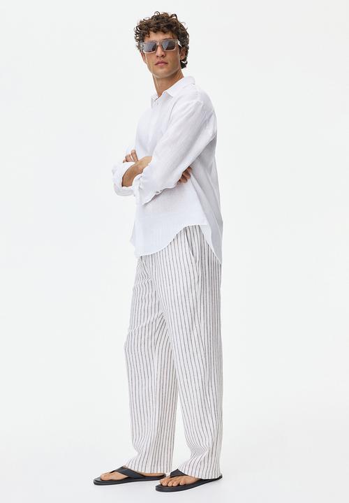 H&M - Relaxed fit linen-blend trousers - white/striped