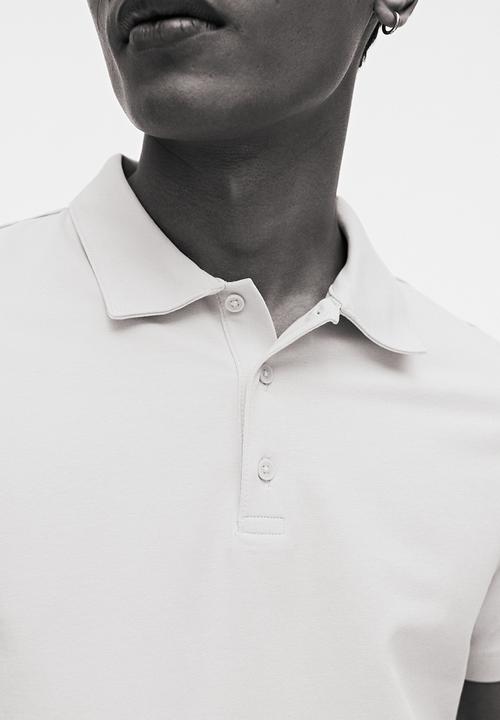 H&M - Slim fit polo shirt  - light blue