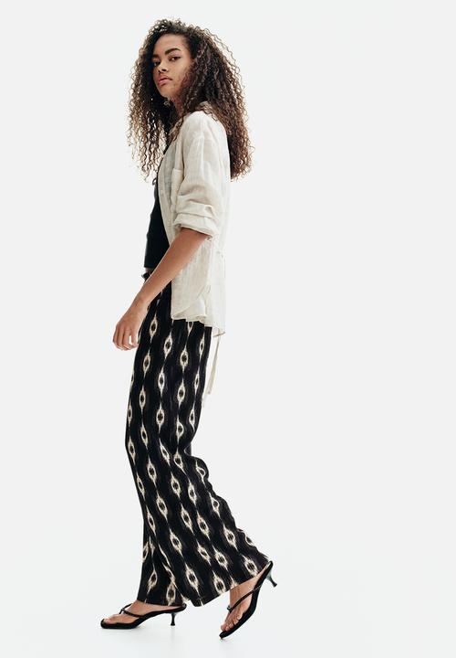 H&M - Wide gathered-waist trousers - black/patterned