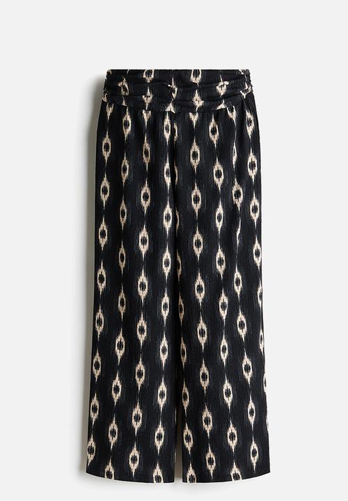 H&M - Wide gathered-waist trousers - black/patterned