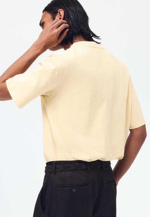 H&M - Relaxed fit printed cotton T-shirt - light yellow/paradis