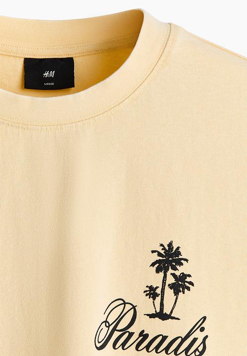 H&M - Relaxed fit printed cotton T-shirt - light yellow/paradis