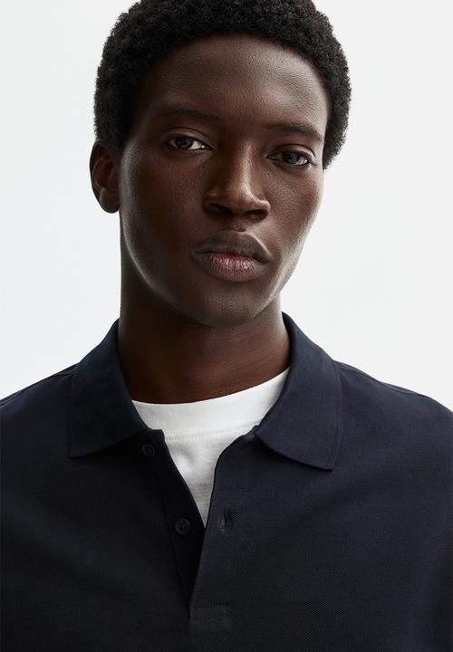 H&M - Regular fit pique polo shirt - navy blue