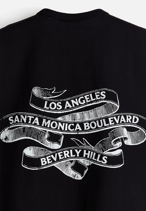 H&M - Loose fit printed vest top - black/los angeles