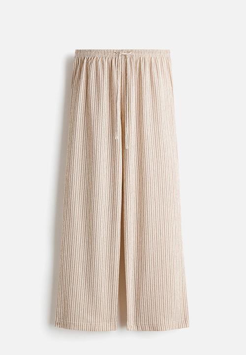 H&M - Wide pull-on trousers - light beige/striped