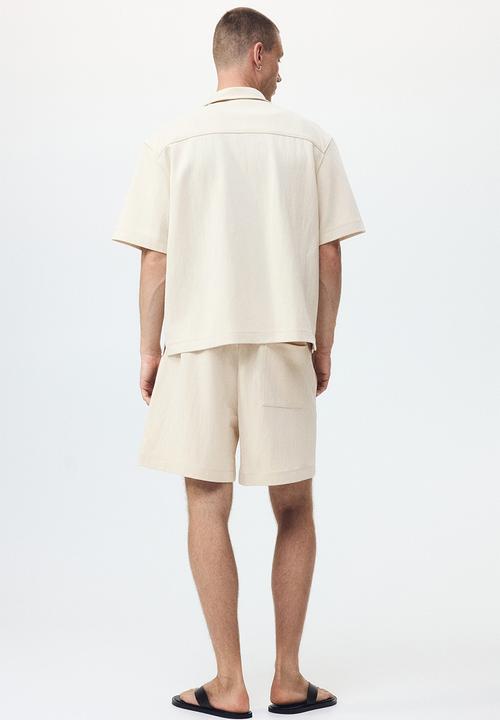 H&M - Relaxed fit interlock shorts - light beige