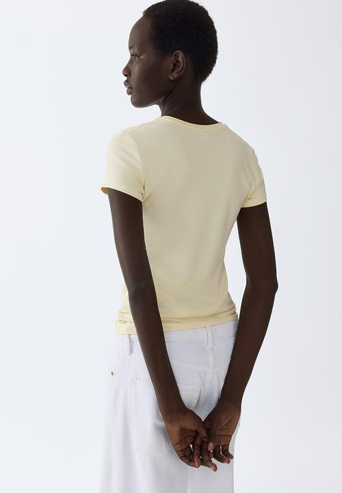 H&M - Fitted microfibre T-shirt - pale yellow