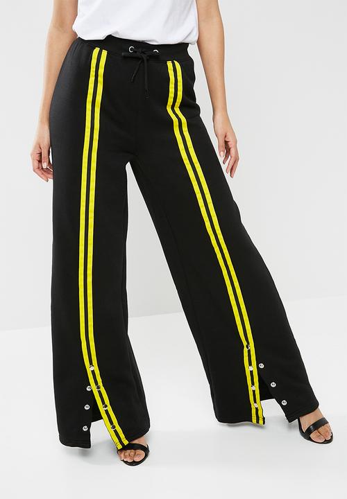 black and yellow striped trousers