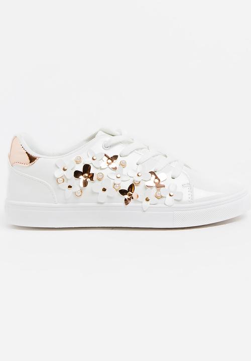 white flower sneakers