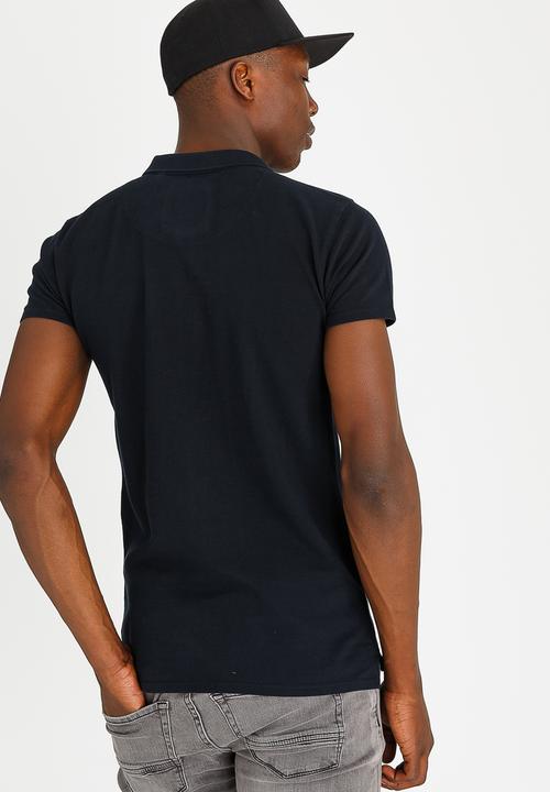 S.P.C.C - Basic Pique Golfer With Rib Collar And Felt Badge Navy