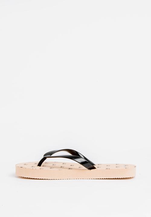 Pop Candy - Printed flip flops - beige & black 