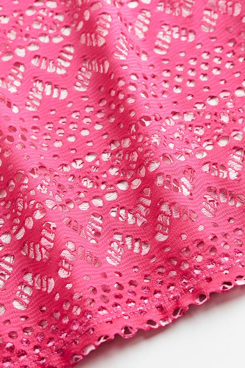 Flared hole patterned jersey trousers - bright pink