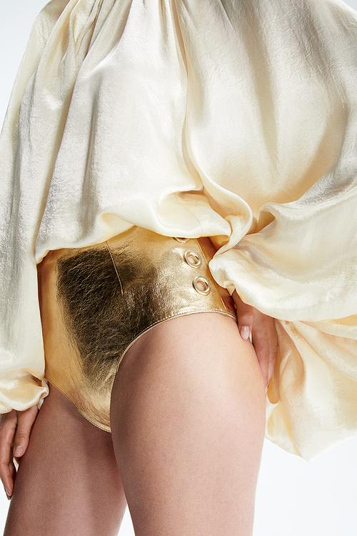 H&M Studio: Eyelet-detail leather mini shorts - gold-coloured