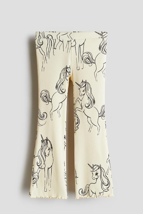 Flared leggings - light yellow unicorns