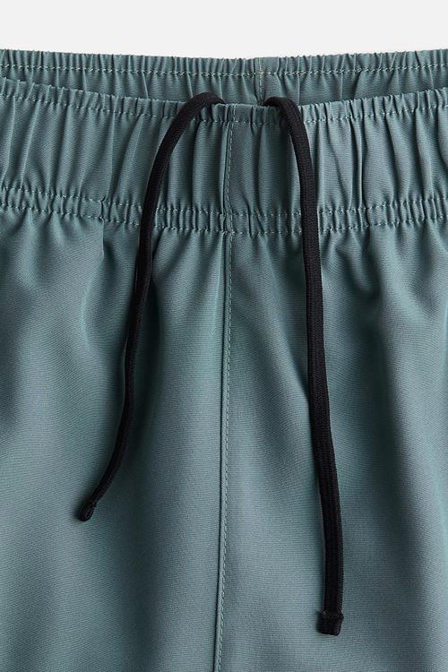 Mid-length sports shorts with drymove™ - turquoise