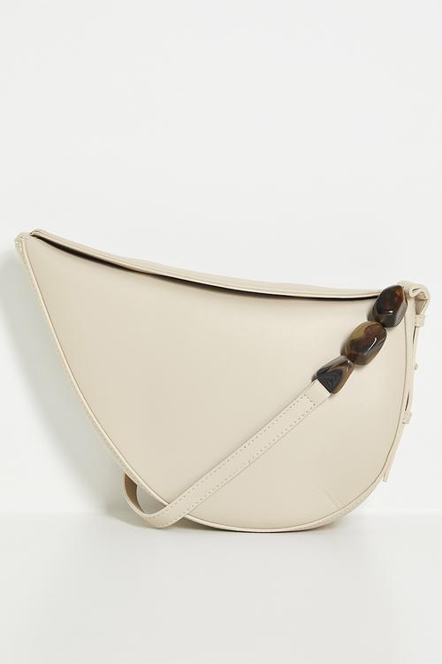 Crescent shaped shoulder bag with beaded strap detail - cream