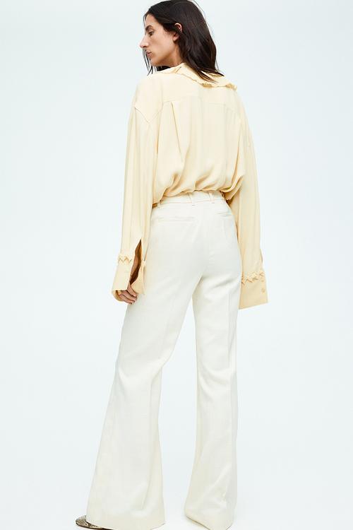 Flared crease-leg trousers - cream