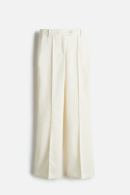 Flared crease-leg trousers - cream