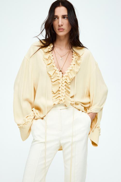 Flared crease-leg trousers - cream