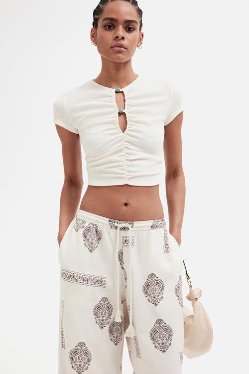 Linen-blend drawstring trousers -  light beige/paisley-patterned 