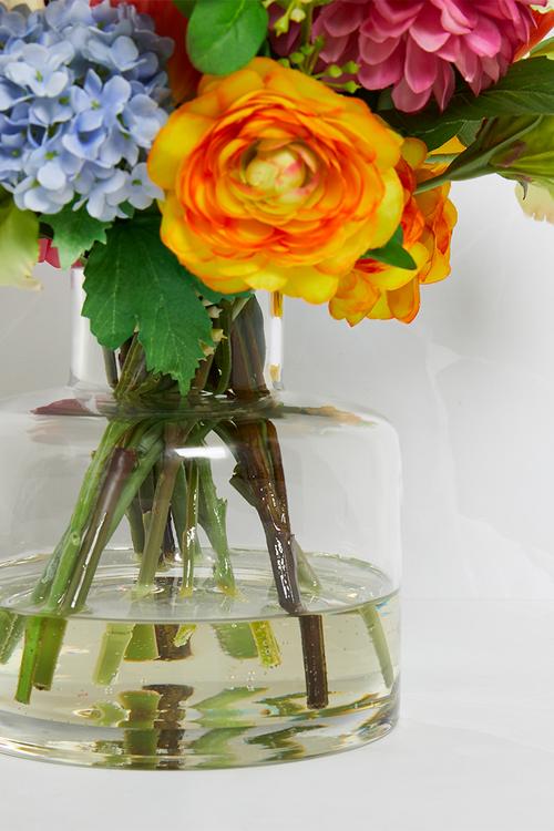Mixed bunch brights in small jar vase