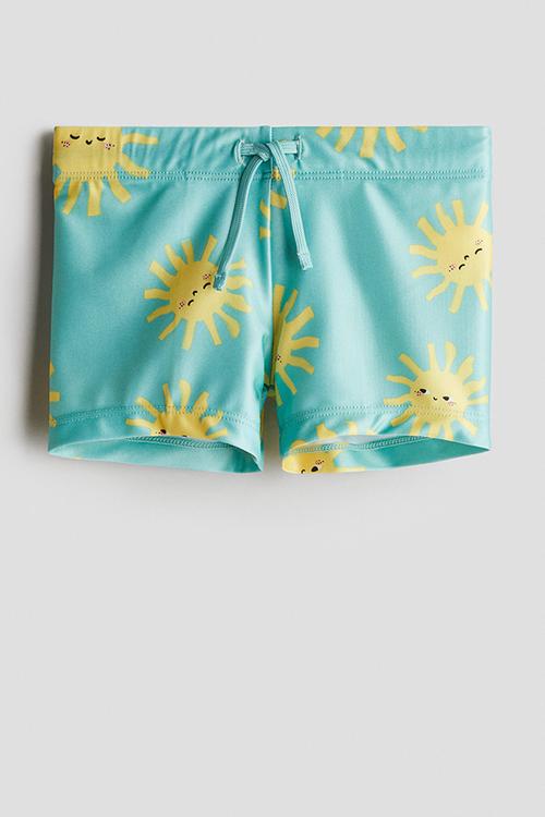 Printed swimming trunks - turquoise suns 